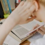 Child Writing on White Paper