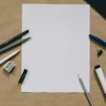 pens near white paper